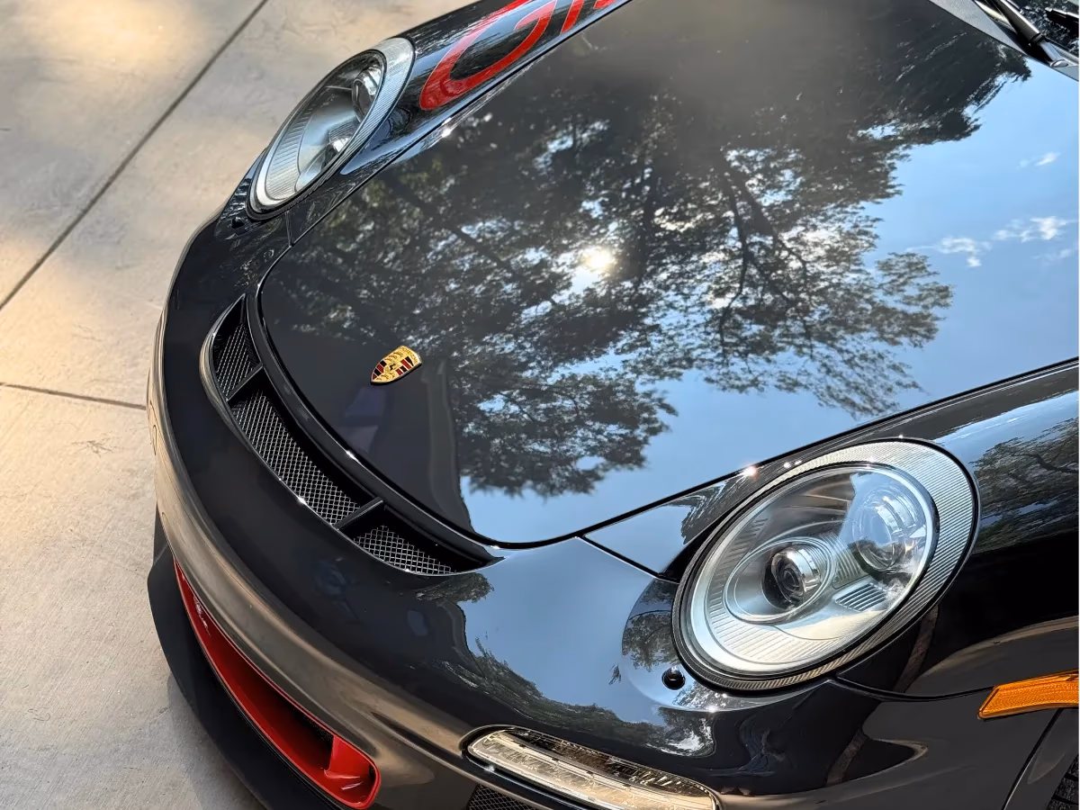 Black Porsche with a deep, glossy ceramic-coated finish