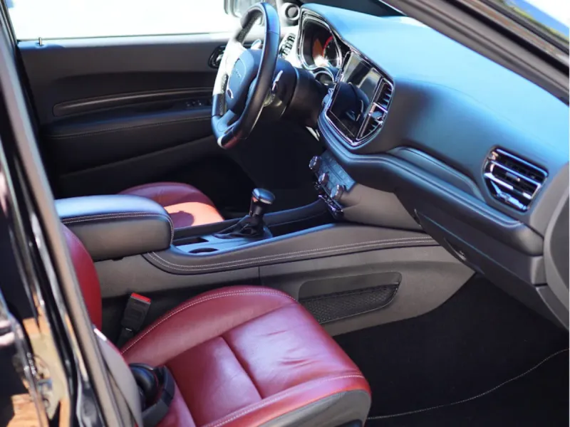 Spotless red leather and black interior after a full interior detail in Kennesaw
